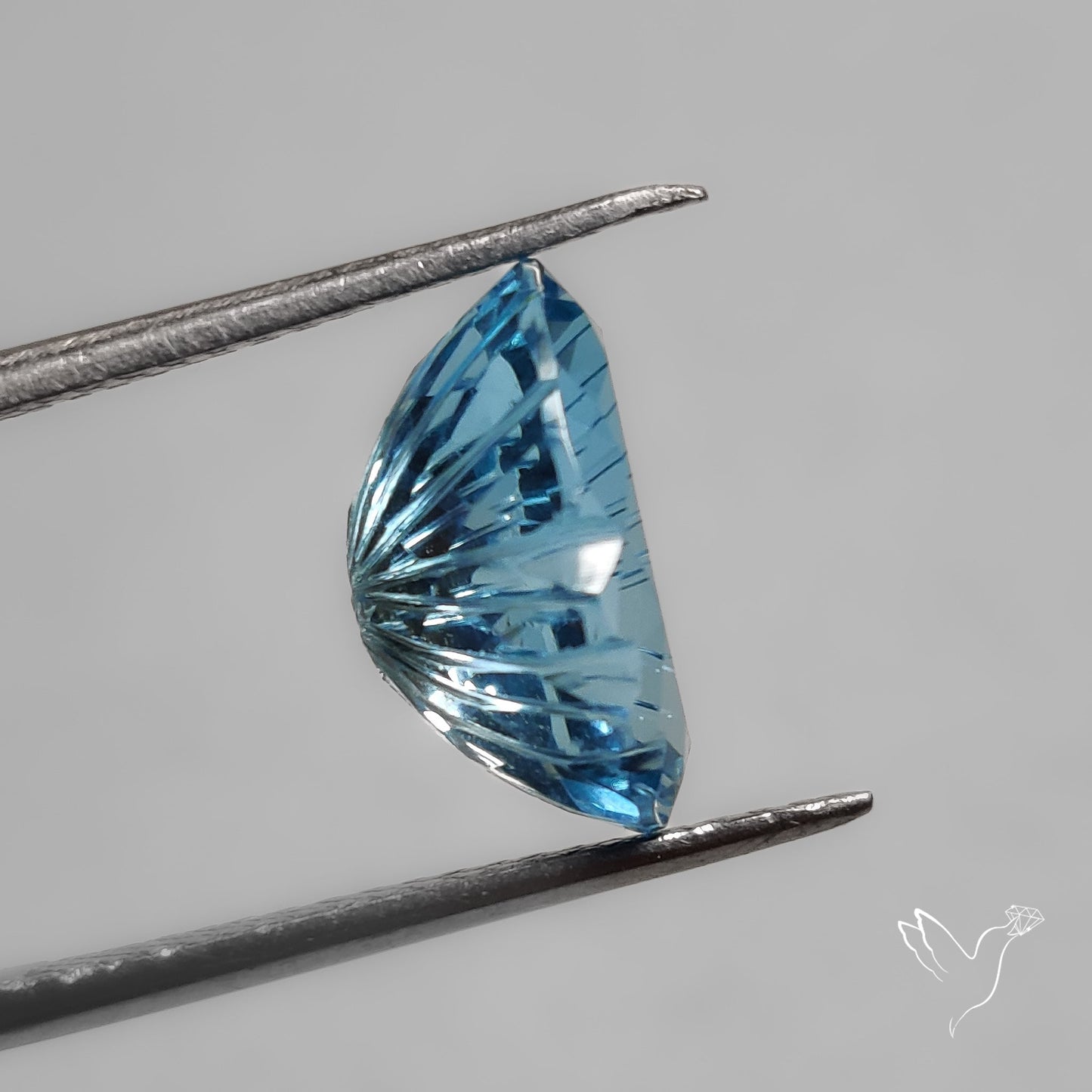 Faceted Swiss Blue Topaz Mughal Carving