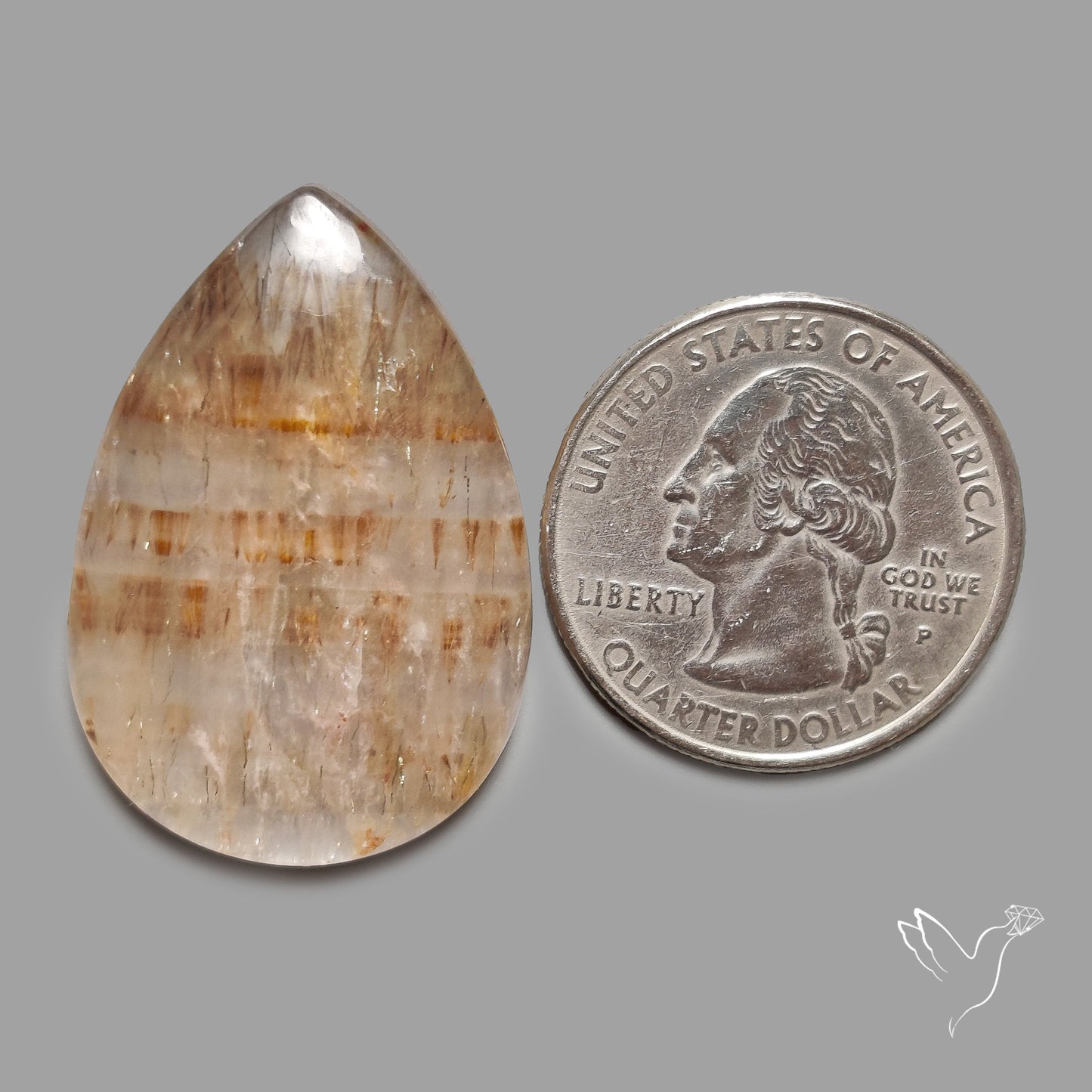 Cacoxenite in Quartz Cabochon