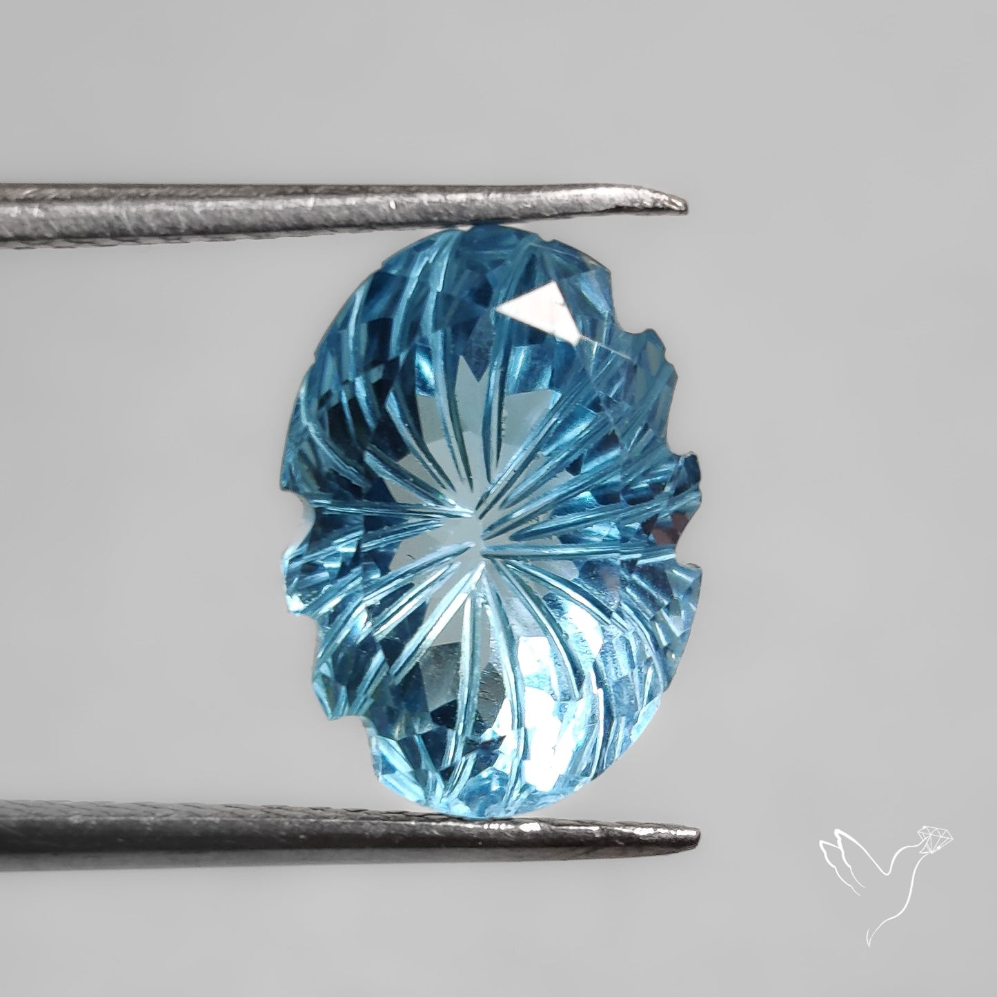 Faceted Swiss Blue Topaz Mughal Carving
